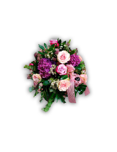 Centerpiece of roses, hydrangeas and complementary flowers
